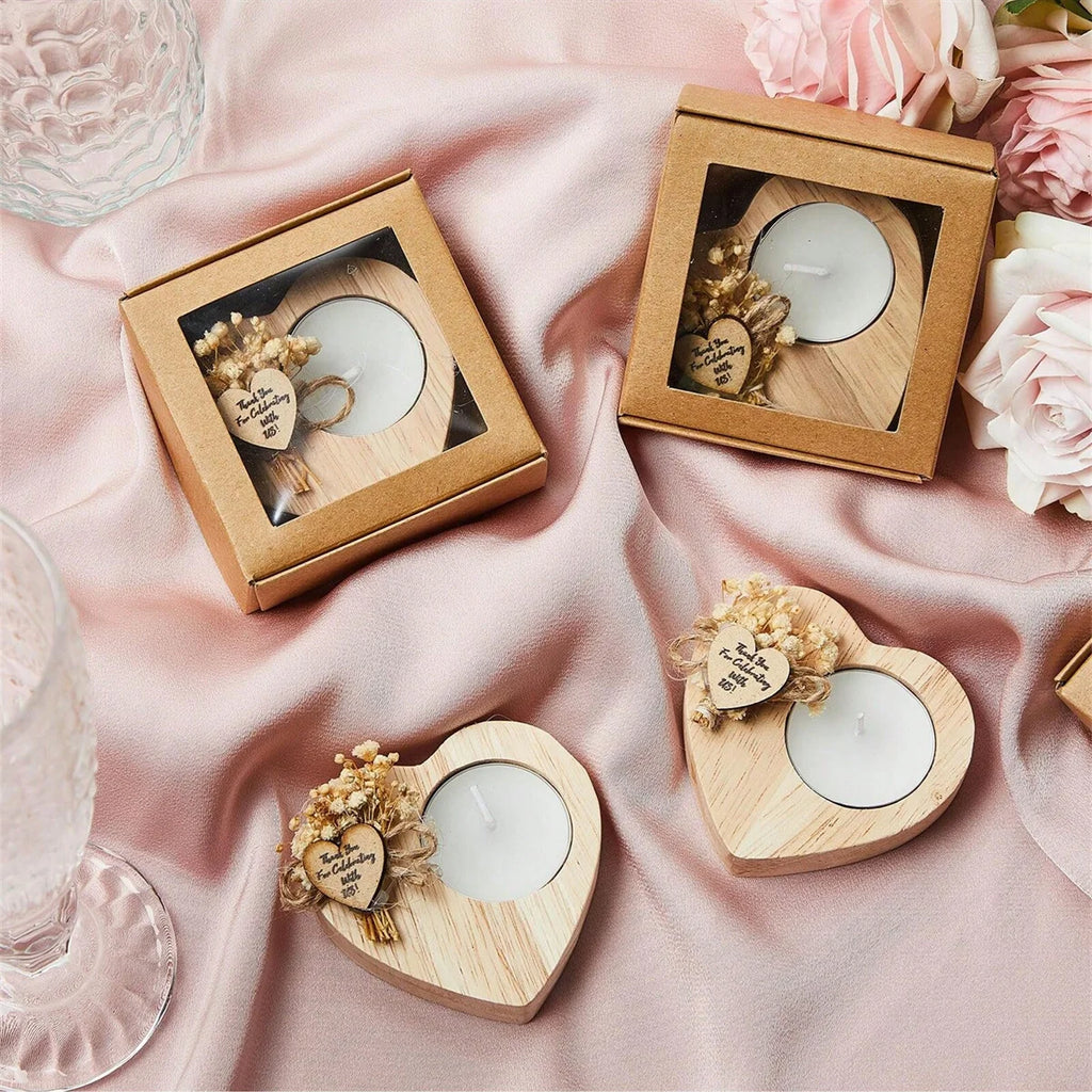 Wedding favor scented candles in heart-shaped wooden holders, in gift boxes