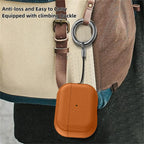 Orange leather-pattern AirPods case with keyring and strap attachment on bag