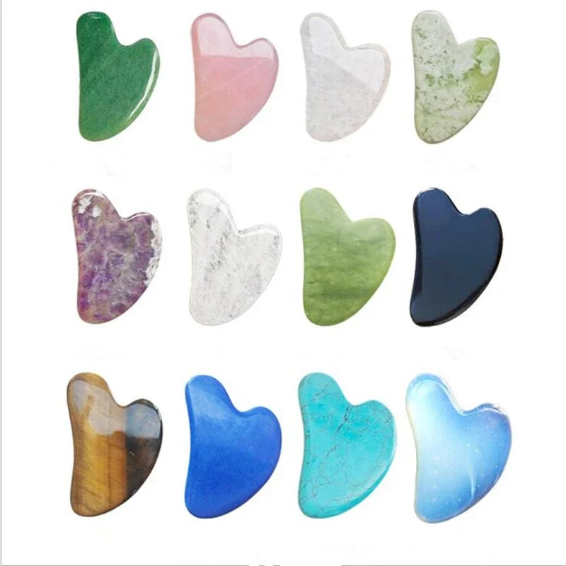 Assorted heart-shaped jade roller stones: green, pale pink, white, light green-speckled, blue, teal, dark blue.
