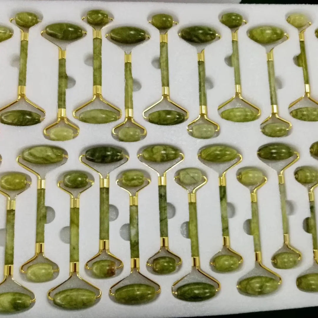 Green jade glow rollers arranged in rows with gold-tone metal heads