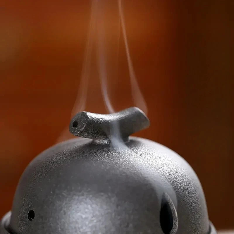 Dark grey ceramic incense stove lid with smoke vent and oval front hole