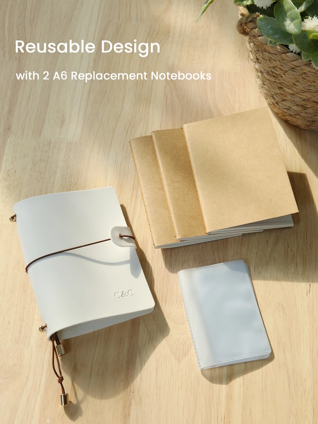 White passport holder with two A6 replacement notebooks and card pocket, closed with strap