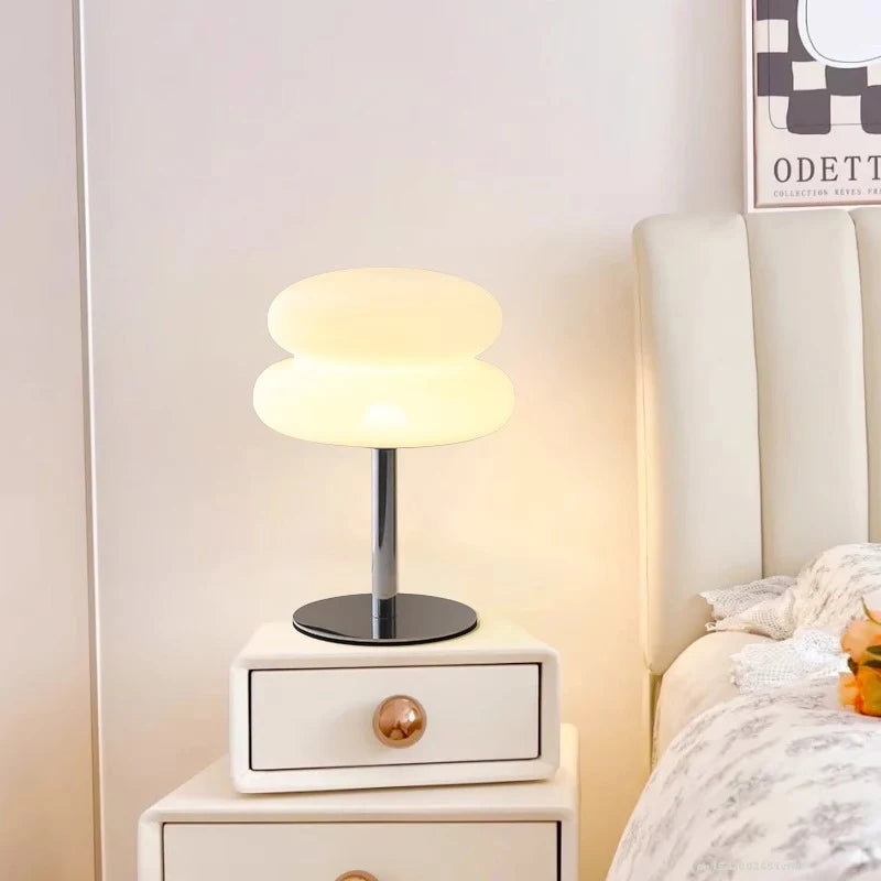 Mushroom USB ambient table lamp glowing warm white, with chrome stem and round base.