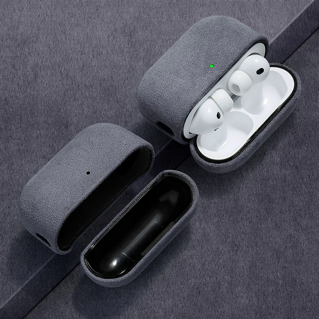 Opened gray Alcantara AirPods case with white AirPods visible in the cradle