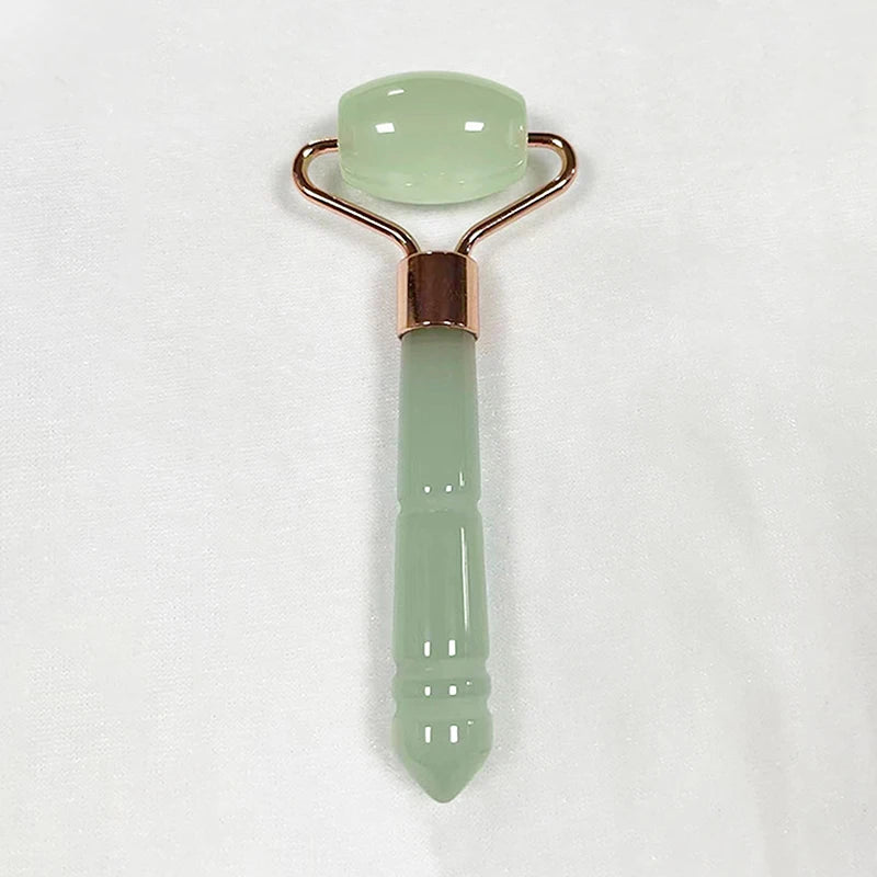 Celadon jade roller massager with rose-gold frame; pale green roller