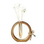 Bamboo Glass reed diffuser bottle close-up with bamboo ring, twine bow, clear glass and white reeds
