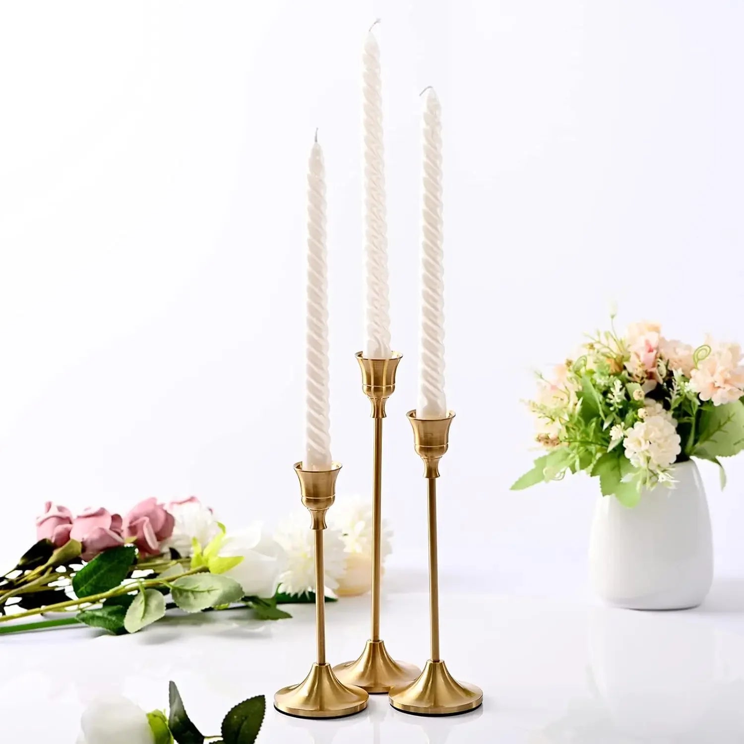 Gold tabletop candle holder set with three holders, long stems and flared tops