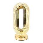 Close-up: pearl white oval lamp body with gold base and inner gold ring details