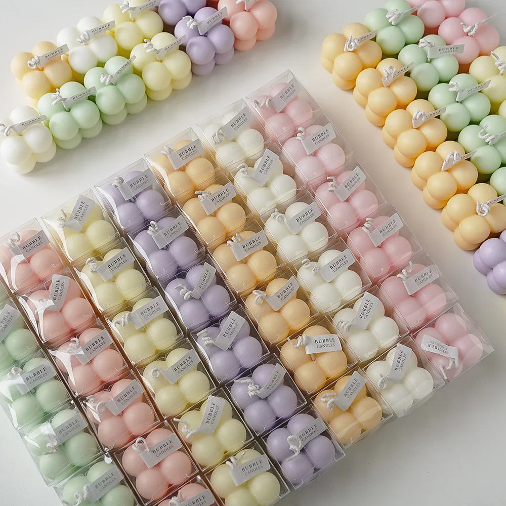 Color Pop sculptural bubble candles assortment in pastel and jewel tones, in clear boxes