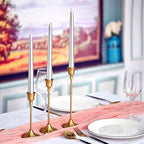 Gold metal tabletop candle holder set with three holders and fluted candlestick stems