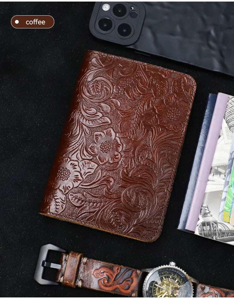 Leather travel folio in cognac brown with embossed floral scroll pattern
