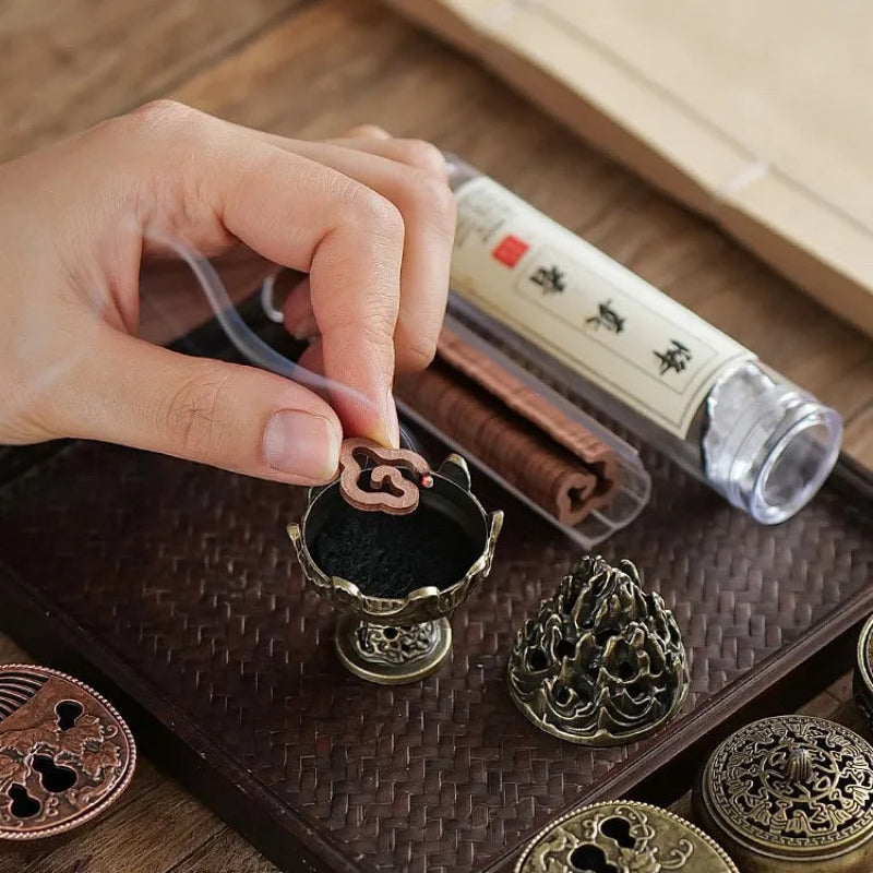 Set of bakhoor incense burners with holder, featuring boshan caps and brass-toned bases.