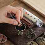 Set of bakhoor incense burners with holder, featuring boshan caps and brass-toned bases.