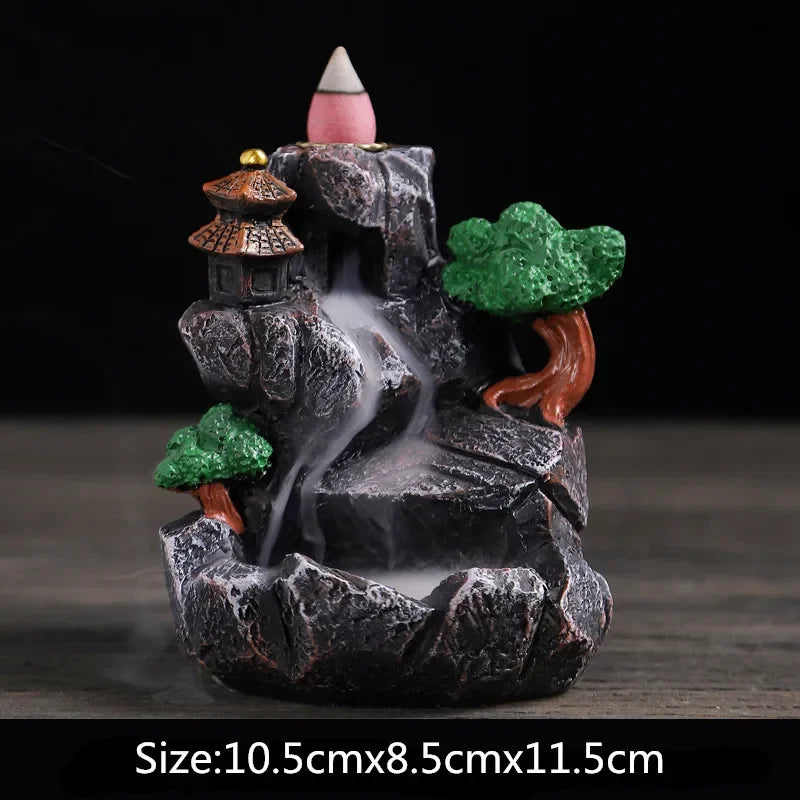 Resin waterfall incense burner, dark rock base with green trees and orange house