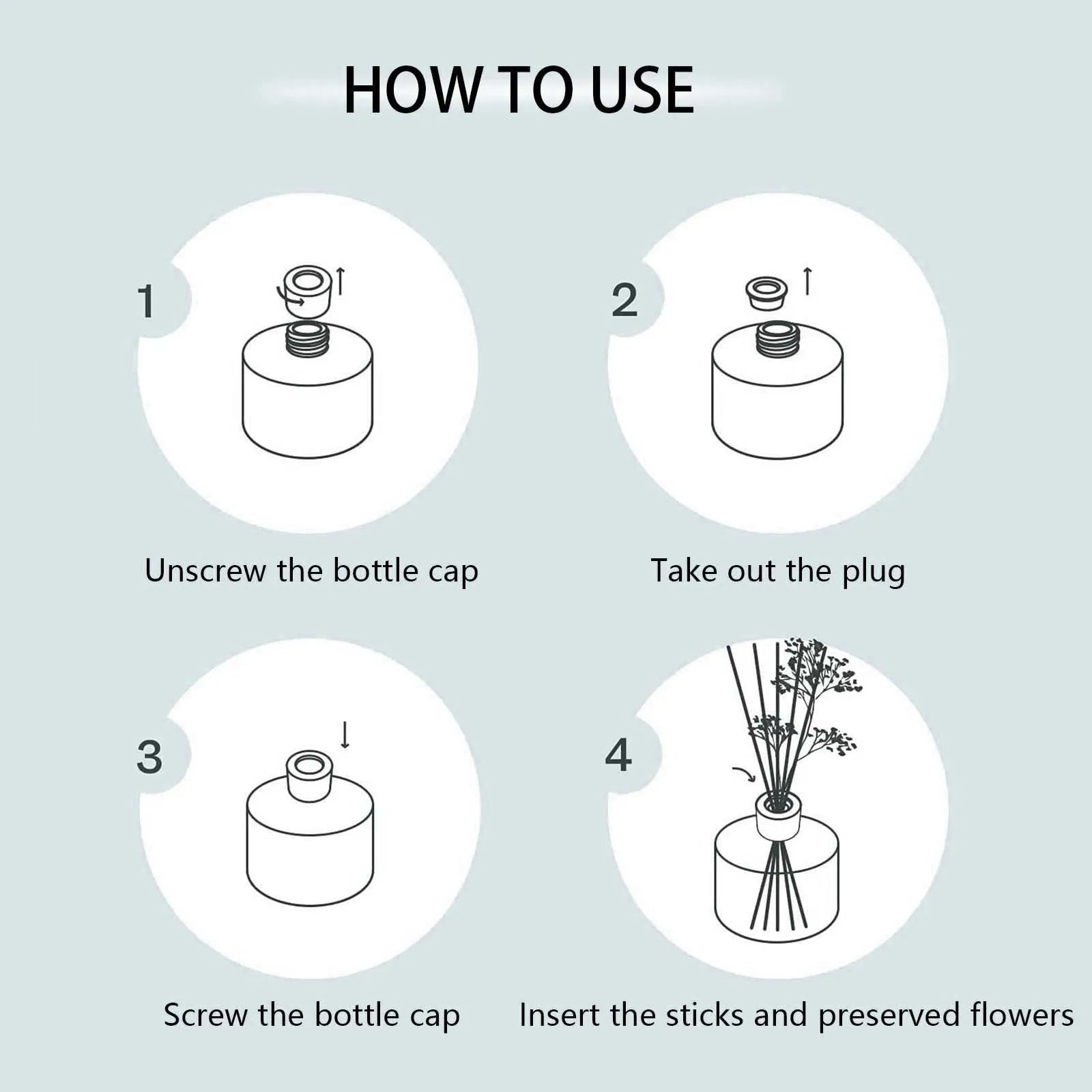 Reed diffuser bottle with black reeds and white rose flower in the glass