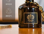 Glass reed diffuser bottle with gold tassel and label, 50ml, amber-brown