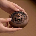 Round solid wood incense tray with metal lattice lid and raised flower-style knob
