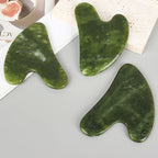 Three heart-shaped jade gua sha tools, green polished Xiuyan jade for facial massage