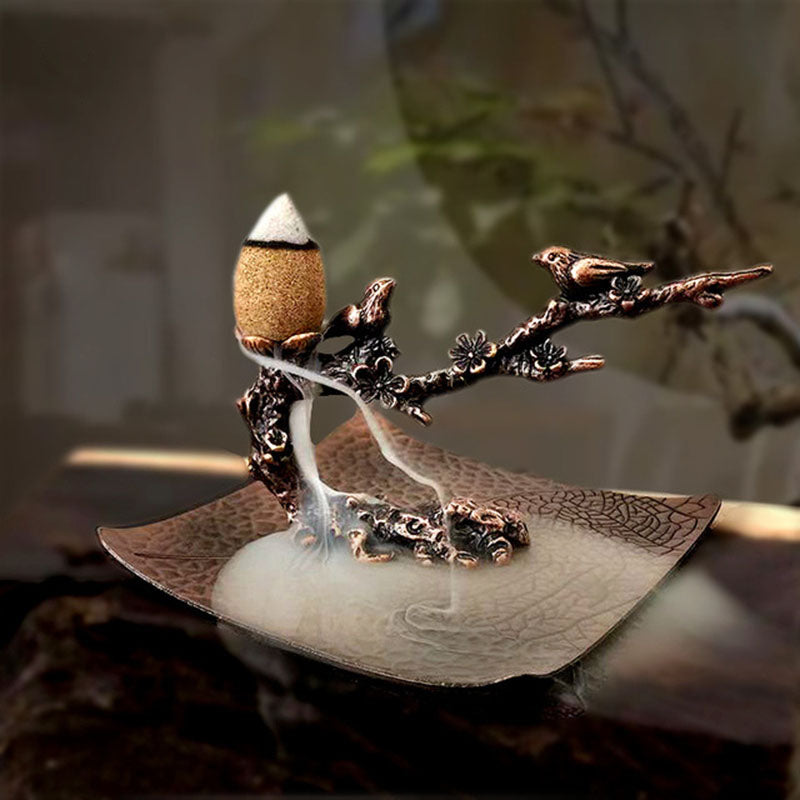 Metal incense stand with plum-branch holder and leaf-shaped ash tray with smoke