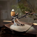Metal incense stand with plum-branch holder and leaf-shaped ash tray with smoke