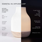 Aroma diffuser with white ribbed ceramic top and wood base, light controls on display