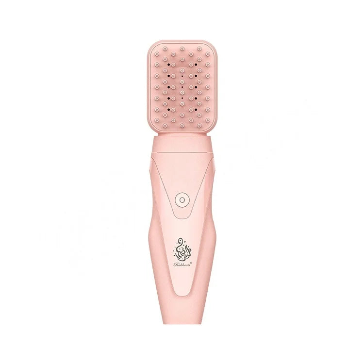 Rose gold USB portable bakhoor burner with open lid and dotted heating grid