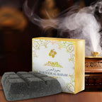 Bakhoor fragrance box with smoke and dark gray incense bricks on tray