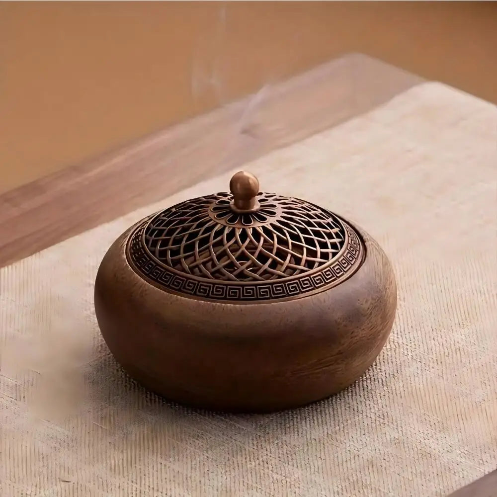 Round solid wood incense tray with ornate metal grille and knob finial