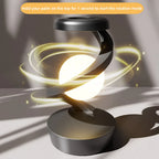 Rotating wireless charging RGB lamp with bright white orb and swirling gold light rings