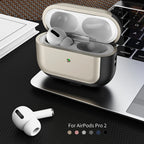 Open champagne gold AirPods case with black leather sides and AirPods Pro earbuds inside