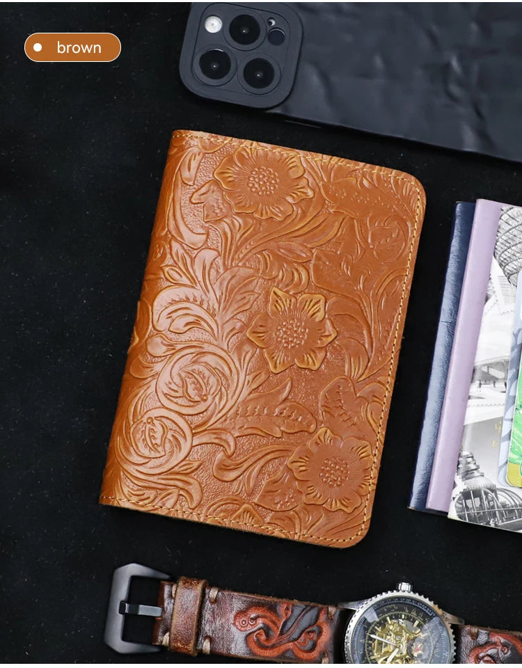 Cognac brown leather travel folio with raised floral embossing and stitched edge
