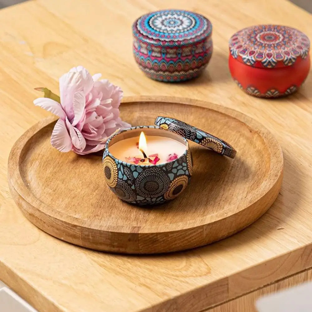 Vintage jar scented candle with patterned ceramic jar lid and lit flower-scented wax