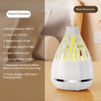 White wood grain aroma diffuser with yellow glowing mist vents, releasing mist.