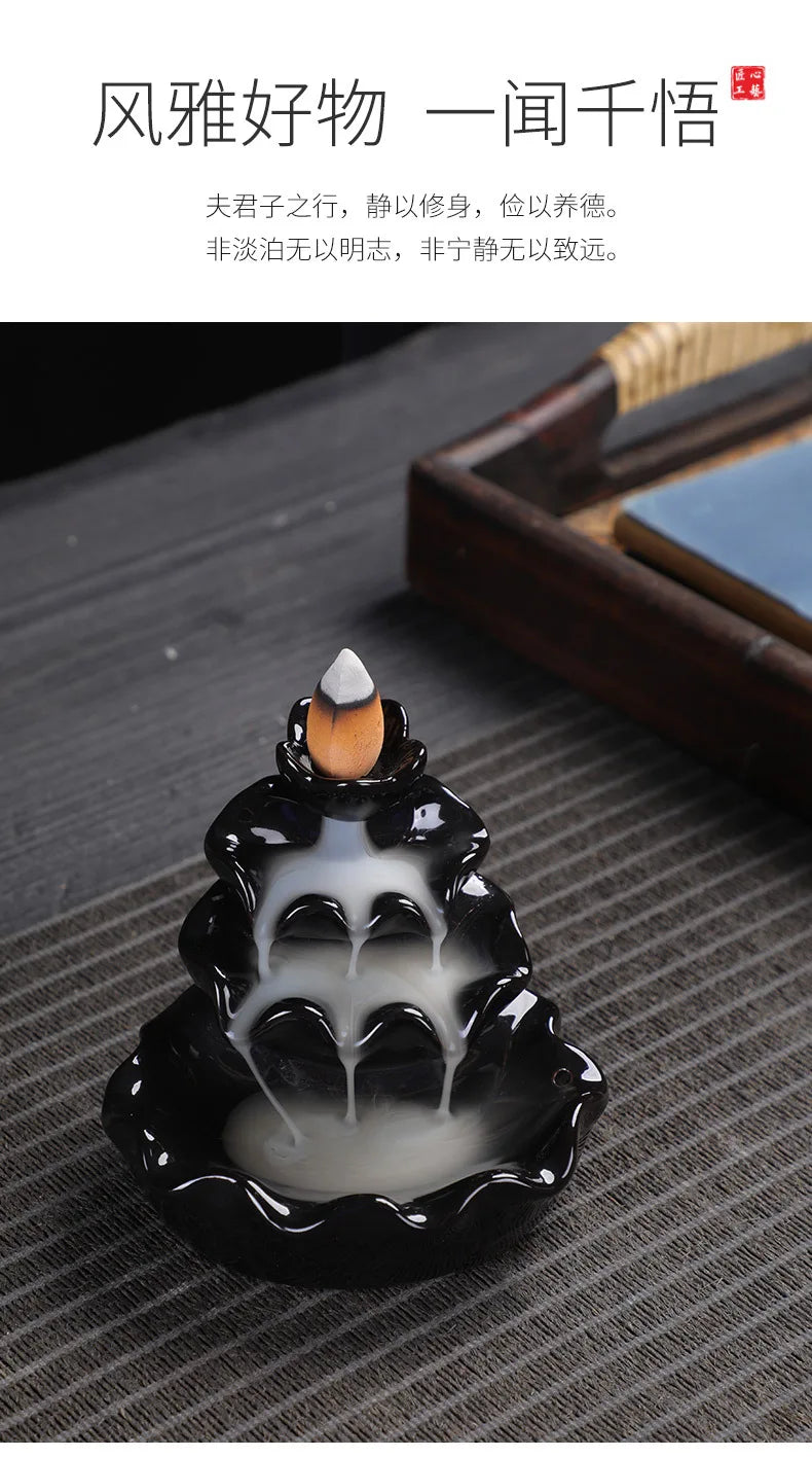 Tower backflow incense burner with black glossy lotuses and central cone smoke