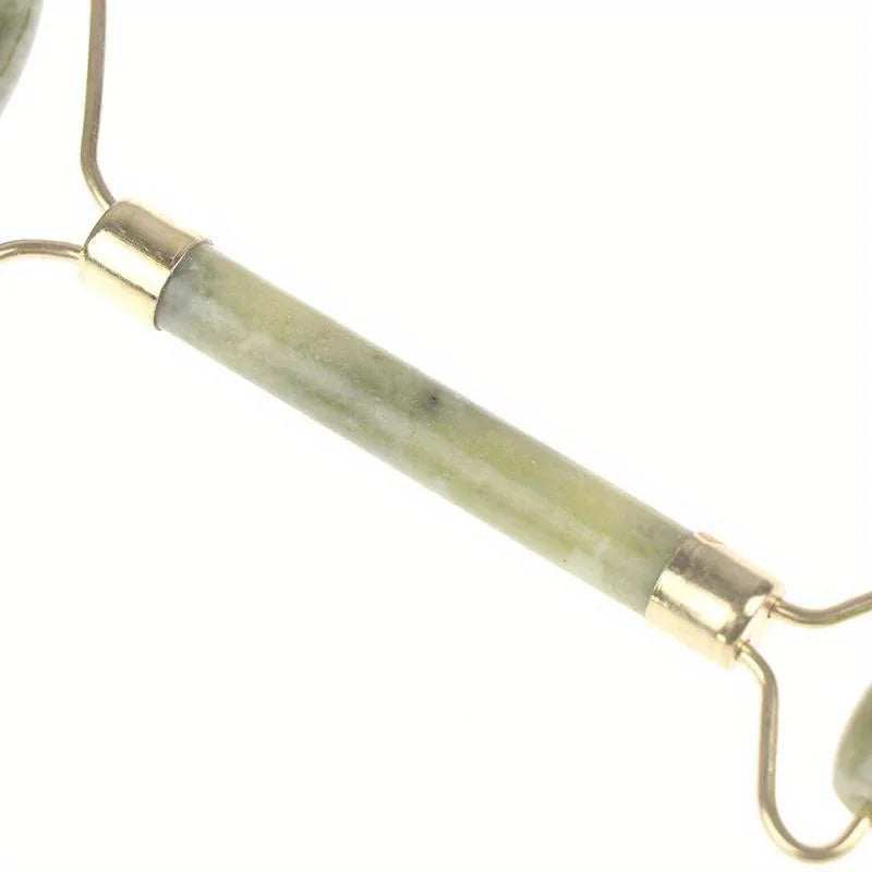 Classic Jade gua sha sculpting board handle and gold connectors, close-up