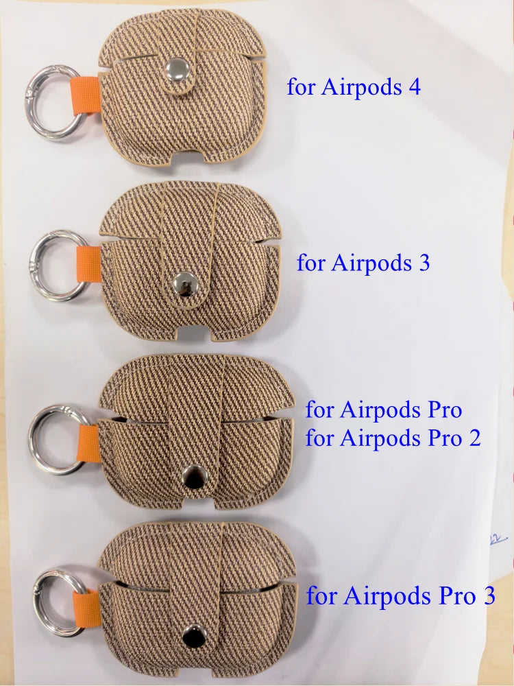 Tan herringbone AirPods case covers with orange pull tab and silver key ring
