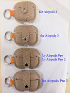 Tan herringbone AirPods case covers with orange pull tab and silver key ring