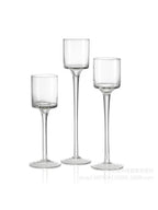 Three-piece tall glass candle holder set, clear cups on slender stems