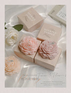 Peach and pink peony sculptural candles in gift boxes with flower shapes