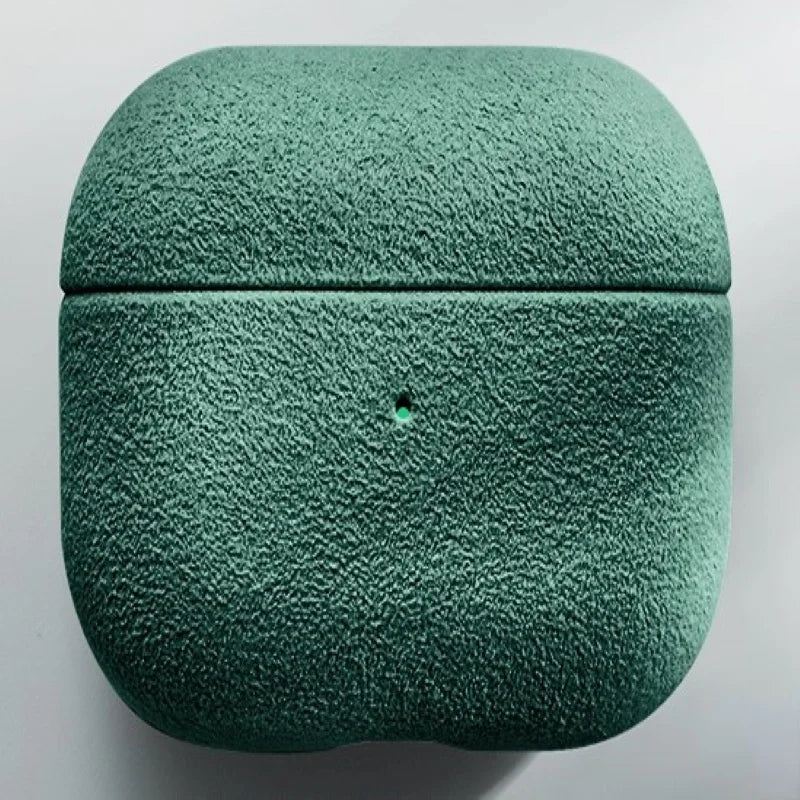 Italian suede AirPods case in Emerald Sage, smooth suede texture, closed