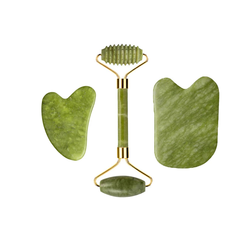 Green jade roller pair with textured comb-style head, plus curved gua sha pieces, gold frames