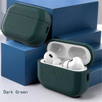 Dark green leather AirPods case with lid open and earbuds inside