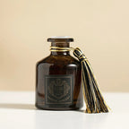 50ml reed diffuser bottle with black cap, gold-thread tassel, and front label