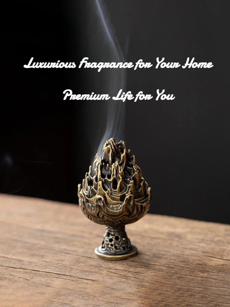 Copper-toned incense burner with flame-lotus top on a base, emitting a vertical plume.