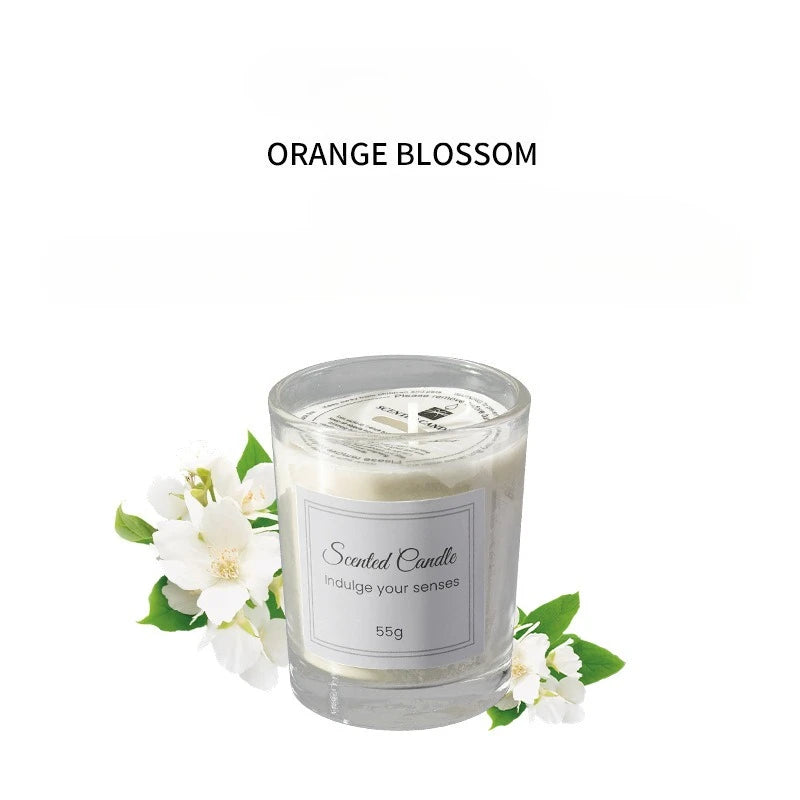 Signature scented candle in glass jar, Orange Blossom scent, 55g label on front.