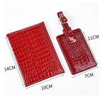 Burgundy passport cover with matching strap and gold-tone square button; size marked