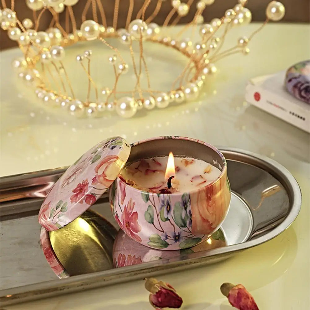Vintage jar scented candle with pink floral jar lid open on a metal tray