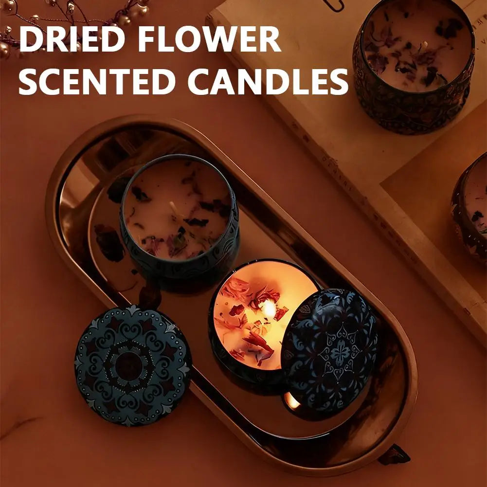 Vintage jar scented candle with ornate black lid and lit wax surface with petals