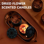 Vintage jar scented candle with ornate black lid and lit wax surface with petals