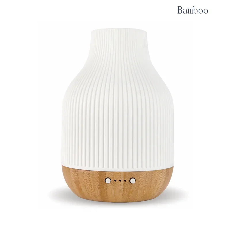 Bamboo aroma diffuser: white ribbed ceramic top and bamboo-colored wood base with buttons